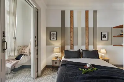 a hallway with white walls and a tile floor at Kaftan - 5 bedrooms and balcony in Eixample Dreta in Barcelona