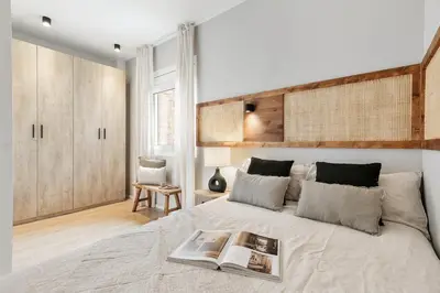 a kitchen and living room with a table and chairs at Ravello - 3 bedroom and terrace in Sant Gervasi in Barcelona