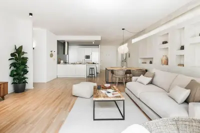 a living room with a couch and a table at Ravello - 3 bedroom and terrace in Sant Gervasi in Barcelona