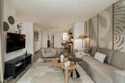 a bedroom with a large bed and a cabinet at Tarra - 4 bedrooms and terrace in Sant Pere in Barcelona