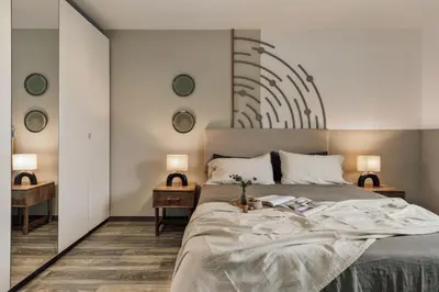 a bedroom with a bed and a mirror at Tarra - 4 bedrooms and terrace in Sant Pere in Barcelona