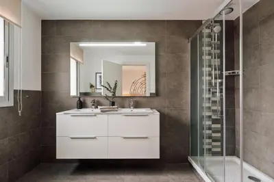 a bedroom with a bed and a mirror at Tarra - 4 bedrooms and terrace in Sant Pere in Barcelona