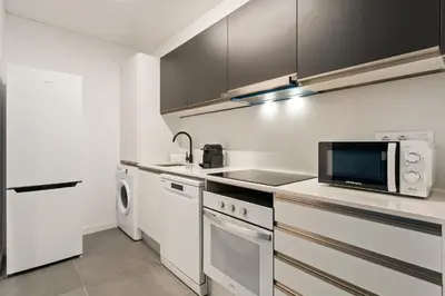 a kitchen with a microwave and a stove top oven at Flateli Espronceda 22 in Barcelona