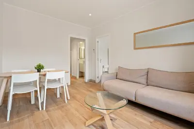 a living room with a couch and a table at Flateli Espronceda 32 in Barcelona