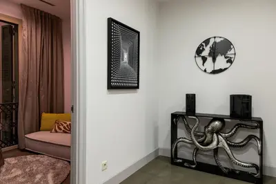 a living room with an octopus on the wall at Paseo de Gracia Icon Apartment in Barcelona
