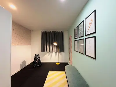 a living room with a couch and a lamp at Stay U-nique Apartment Roma in Barcelona