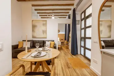 a living room with a table and a couch at Lodging Apartments Almirall Beach B1 in Barcelona
