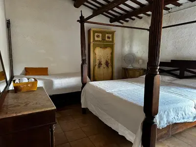 a bedroom with two beds in a room at Maset del Garraf in Olesa de Bonesvalls