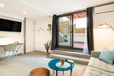 a living room with a couch and a table at Stay U-nique Tapioles Central Apartment in Barcelona