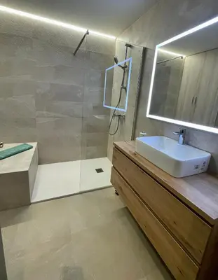a bathroom with a shower and a sink and a tub at Apartamento de lujo a pie de metro in Terrassa