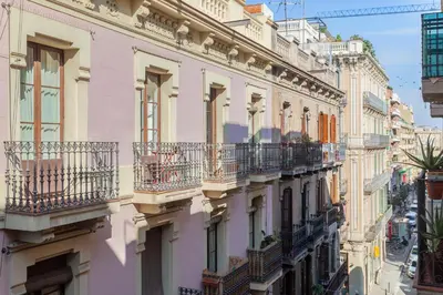 a row of buildings with balconies on a city street at Art House Travessera de Gràcia-2 in Barcelona