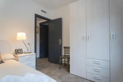 a bedroom with a bed and a dresser and a desk at Can Davilas Rustic Mountain House in Monistrol de Calders