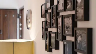 a wall of framed pictures on a wall in a room at Can Davilas Rustic Mountain House in Monistrol de Calders