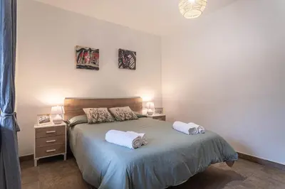 a bedroom with a bed with two towels on it at Can Davilas Rustic Mountain House in Monistrol de Calders