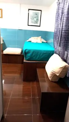 a small room with a bed and a blue mattress at Coliving 87 estudio numero 10 in Barcelona