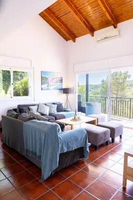 a living room with couches and a table at Yasmine Casas Barcelona in Olivella