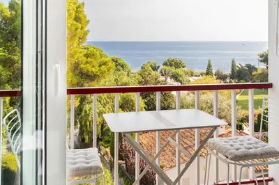 a balcony with a view of the ocean at SeaSunSand Apartment in San Pol de Mar