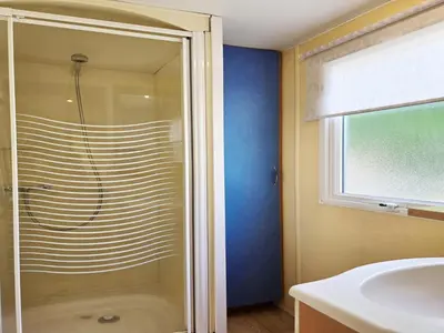 a bathroom with a shower and a sink at Bungalow in Canet de Mar near Scenic Beach in Canet de Mar