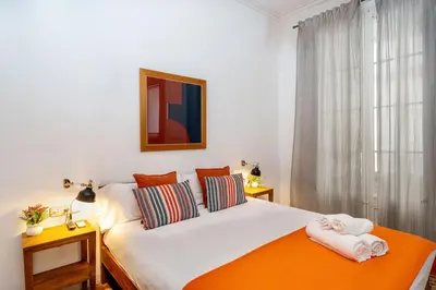 a bedroom with a bed with two towels on it at Luxury Business Apartment Gran Vía - 2 rooms - Romantic Eixample - 8min Passeig Gràcia in Barcelona