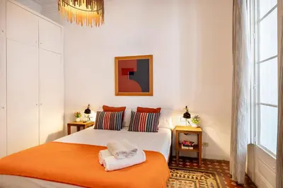 a bedroom with a bed with two towels on it at Luxury Business Apartment Gran Vía - 2 rooms - Romantic Eixample - 8min Passeig Gràcia in Barcelona