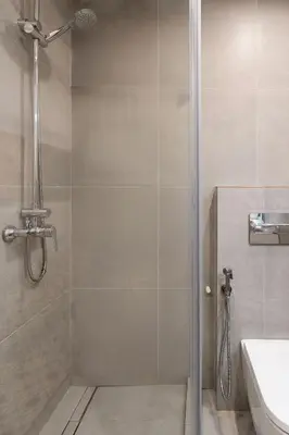 a bathroom with a shower with a toilet and a sink at Luxury Business Apartment Gran Vía - 2 rooms - Romantic Eixample - 8min Passeig Gràcia in Barcelona