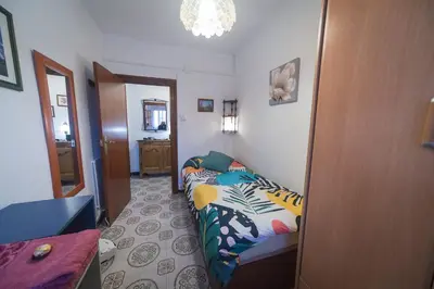 a small bedroom with a bed and a hallway at Comodo y luminoso en Cornella -Barcelona- in Cornellà de Llobregat