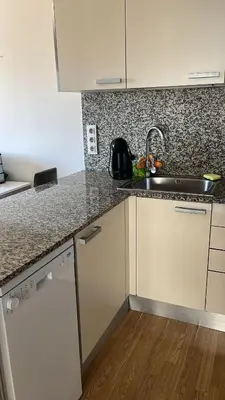 a kitchen with a sink and a counter top at Habitación mediana in Santa Coloma