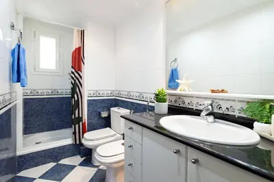 a bathroom with a toilet and a sink at Apartamento Moderno con Balcón Meridiana Barcelona in Barcelona