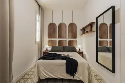 a hallway with white walls and a tile floor at Loma - 3 bedrooms and office in Eixample Esquerra in Barcelona