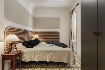 a living room with a couch and a table at Loma - 3 bedrooms and office in Eixample Esquerra in Barcelona