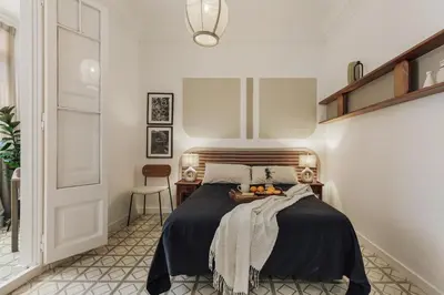 a living room with a table and a couch at Loma - 3 bedrooms and office in Eixample Esquerra in Barcelona