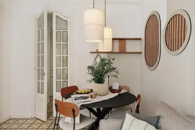 a bedroom with a large bed and a mirror at Loma - 3 bedrooms and office in Eixample Esquerra in Barcelona