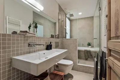 a bedroom with a large bed with aokedokedokedoked at Lura - 2 bedrooms and terrace in Eixample Esquerra in Barcelona