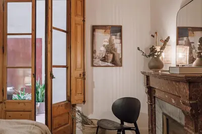 a kitchen with a wooden door and a table at Alajar - 3 bedrooms in St Pere Sta Caterina in Barcelona