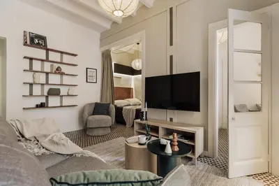 a living room with a couch and a table at Tiqui - 1 bedroom and balcony in Vila de Gràcia in Barcelona