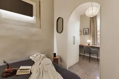 a bedroom with a bed and a pendant light at Tiqui - 1 bedroom and balcony in Vila de Gràcia in Barcelona
