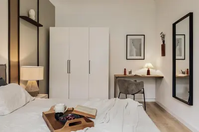 a living room with a tv and a coffee table at Quira - 4 bedrooms and balcony in Eixample Dreta in Barcelona