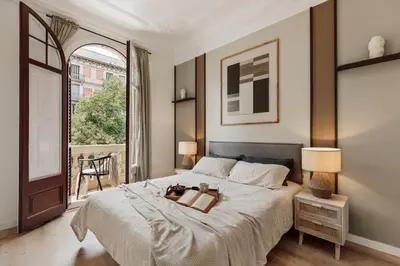a living room with a dining room table and chairs at Quira - 4 bedrooms and balcony in Eixample Dreta in Barcelona