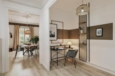a bedroom with a bed and a night stand with a lamp at Quira - 4 bedrooms and balcony in Eixample Dreta in Barcelona