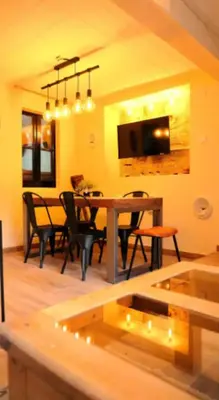 a dining room with a table and chairs in a room at Hermoso Apartamento cerca a Barcelona in Sant Adria de Besos
