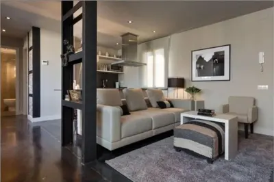 a living room with a couch and a table at Stay Unique Apartment Minerva in Barcelona