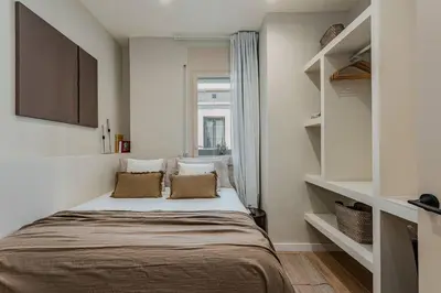 a bedroom with a large bed with a window at Bright Apartment in Barcelona in Barcelona