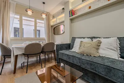 a living room with a couch and a table at Bright Apartment in Barcelona in Barcelona