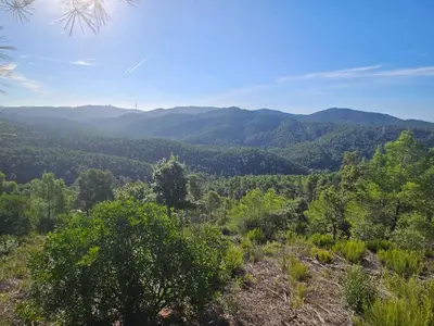 a view of the mountains from the top of a hill at Poolside Apartment Barcelona Sant Cugat in Sant Cugat del Vallès