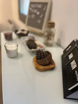 a table with some cookies and a book on it at Barceloneta Love 1 min to the beach in Barcelona