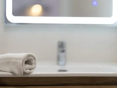a towel sitting on a counter in front of a tv at Winahost Barcelona Gracia in Barcelona