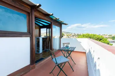 a balcony with a table and chairs on it at Mediterranean heaven with sea views in Alella