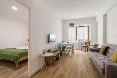 a living room with a couch and a table at Stay Unique Apartment Taquigraf in Barcelona