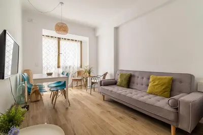a living room with a couch and a table at Stay Unique Apartment Taquigraf in Barcelona