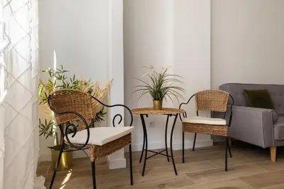 a room with chairs and a table and a couch at Stay Unique Apartment Taquigraf in Barcelona